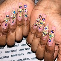 two-hands-with-acrylic-nails-with-gems